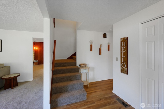 4036 Debbie Ct SE, Olympia, WA 98501 - stairway with wood finished floors and a textured ceiling