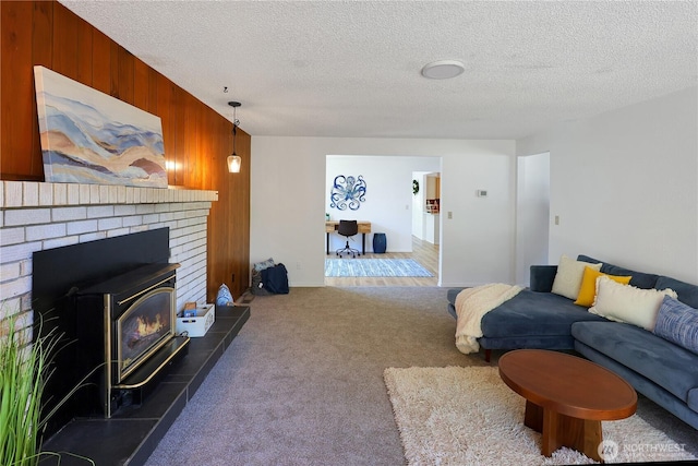 4036 Debbie Ct SE, Olympia, WA 98501 - carpeted living room featuring wood walls and a textured ceiling