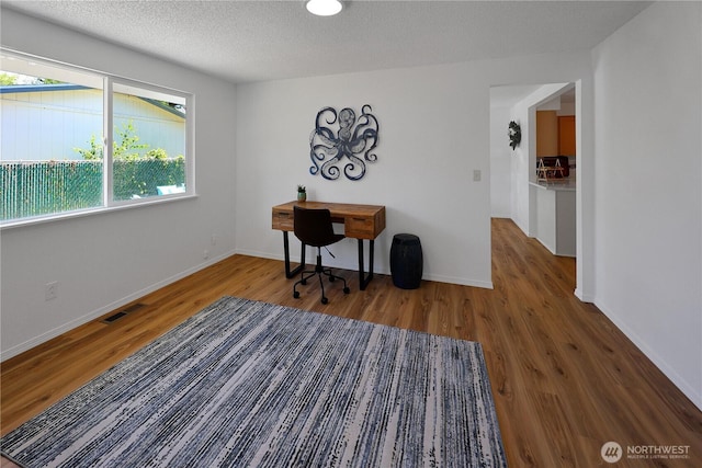 4036 Debbie Ct SE, Olympia, WA 98501 - home office with wood finished floors and a textured ceiling