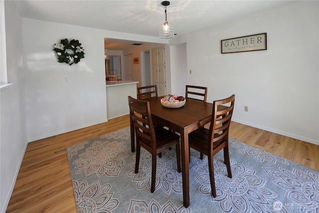 4036 Debbie Ct SE, Olympia, WA 98501 - dining area featuring light wood finished floors and a textured ceiling