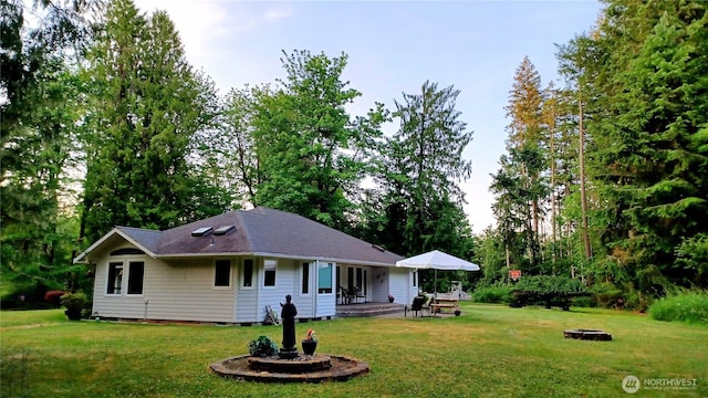 1225 98th Ln SE, Olympia, WA 98501 - view of front facade with a front yard and an outdoor fire pit
