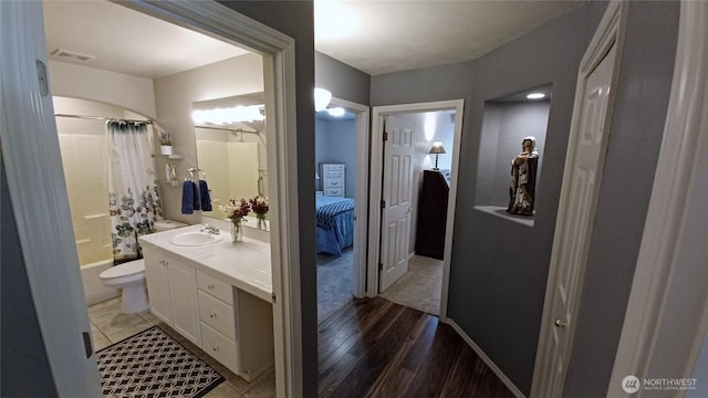 1225 98th Ln SE, Olympia, WA 98501 - bathroom with vanity, shower / bath combination with curtain, and wood finished floors