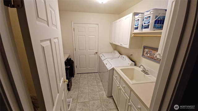 1225 98th Ln SE, Olympia, WA 98501 - washroom featuring cabinet space, washer and dryer, and light tile patterned floors