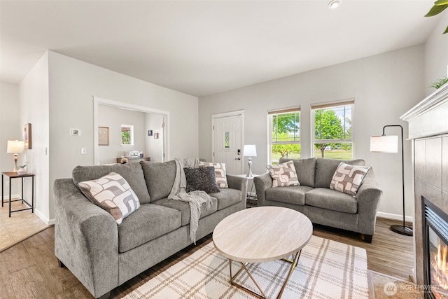 5611 Balustrade Blvd SE, Lacey, WA 98513 - living room with wood finished floors and a tiled fireplace