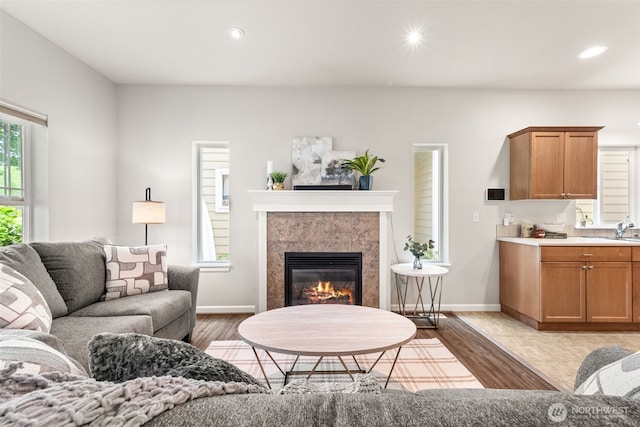 5611 Balustrade Blvd SE, Lacey, WA 98513 - living area with wood finished floors, recessed lighting, and a tile fireplace