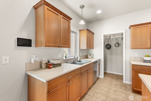 5611 Balustrade Blvd SE, Lacey, WA 98513 - kitchen with light countertops, dishwasher, and hanging light fixtures