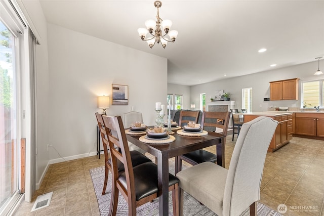 5611 Balustrade Blvd SE, Lacey, WA 98513 - dining space featuring healthy amount of natural light, light tile patterned flooring, recessed lighting, and a chandelier