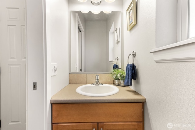 5611 Balustrade Blvd SE, Lacey, WA 98513 - bathroom featuring vanity and decorative backsplash