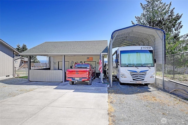 1985 Elhardt St, Camano Island, WA 98282 - view of front of house with roof with shingles, a detached carport, and driveway