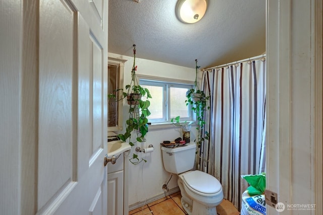 218 SW 15th St, Long Beach, WA 98631 - full bath featuring a textured ceiling, a shower with shower curtain, tile patterned floors, and vanity