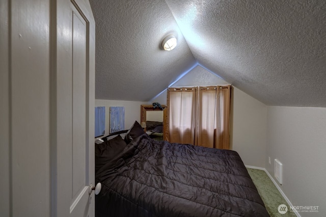 218 SW 15th St, Long Beach, WA 98631 - bedroom with a textured ceiling, vaulted ceiling, and carpet