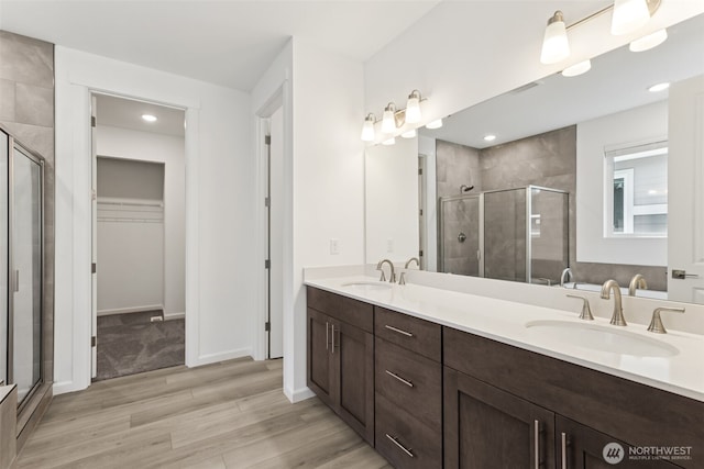 20420 97th Ave E Unit 5, Graham, WA 98338 - full bathroom with a shower stall, double vanity, wood finished floors, and recessed lighting