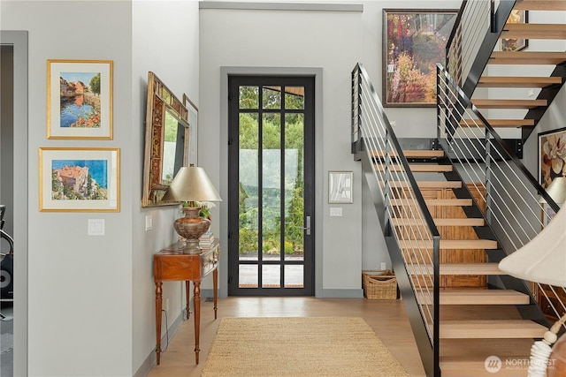 181 Utsalady Rd, Camano Island, WA 98282 - foyer entrance featuring stairs, wood finished floors, and a high ceiling