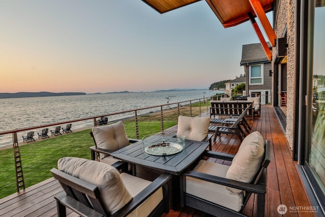 181 Utsalady Rd, Camano Island, WA 98282 - balcony at dusk with outdoor dining space and a deck with water view