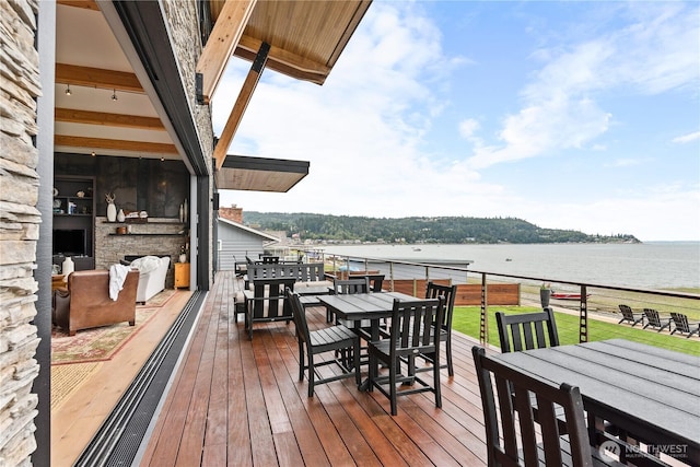 181 Utsalady Rd, Camano Island, WA 98282 - wooden deck with outdoor dining area and a water view