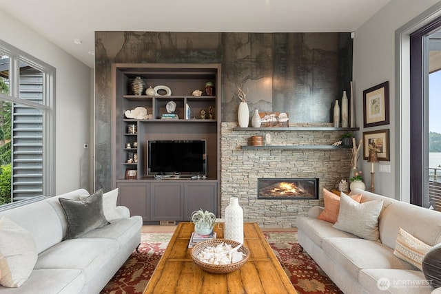 181 Utsalady Rd, Camano Island, WA 98282 - living room with plenty of natural light, a fireplace, and built in features