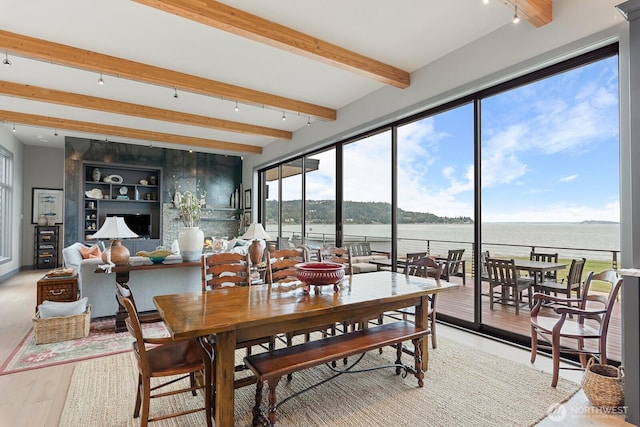 181 Utsalady Rd, Camano Island, WA 98282 - dining room featuring beamed ceiling, track lighting, light wood-type flooring, and a water view