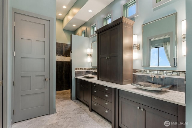 181 Utsalady Rd, Camano Island, WA 98282 - bathroom with plenty of natural light, double vanity, tasteful backsplash, and recessed lighting