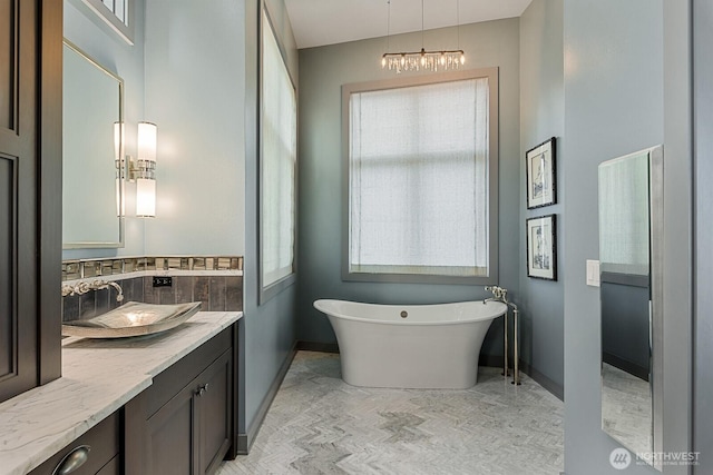 181 Utsalady Rd, Camano Island, WA 98282 - full bath featuring vanity, a soaking tub, and backsplash