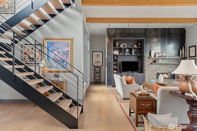 181 Utsalady Rd, Camano Island, WA 98282 - living room with stairs, wood finished floors, and a stone fireplace