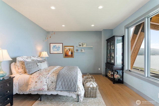 181 Utsalady Rd, Camano Island, WA 98282 - bedroom with multiple windows, wood finished floors, and recessed lighting