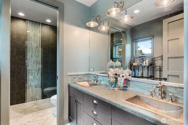 181 Utsalady Rd, Camano Island, WA 98282 - full bath with double vanity, a tile shower, tasteful backsplash, and recessed lighting