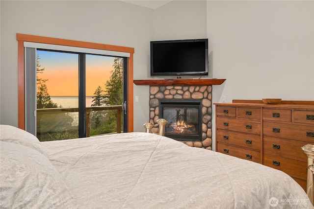229 Chuckanut Point Rd, Bellingham, WA 98229 - bedroom with access to outside, a fireplace, and multiple windows