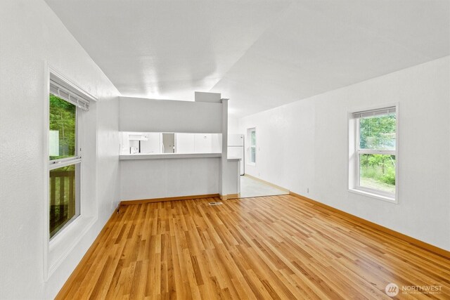 8363 Holly Ln, Maple Falls, WA 98266 - unfurnished living room featuring light wood-type flooring and baseboards