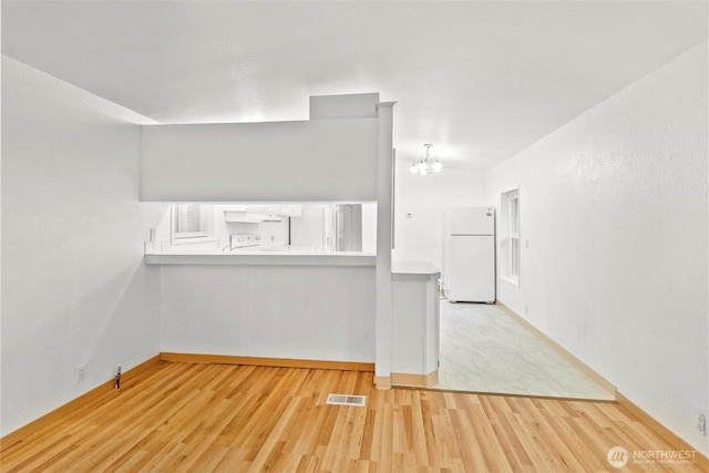 8363 Holly Ln, Maple Falls, WA 98266 - unfurnished living room featuring a chandelier and wood finished floors