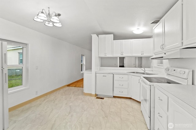 8363 Holly Ln, Maple Falls, WA 98266 - kitchen with white appliances, under cabinet range hood, light countertops, and white cabinets