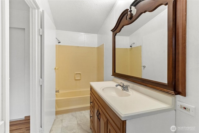 8363 Holly Ln, Maple Falls, WA 98266 - bathroom with vanity, bathtub / shower combination, and a textured ceiling
