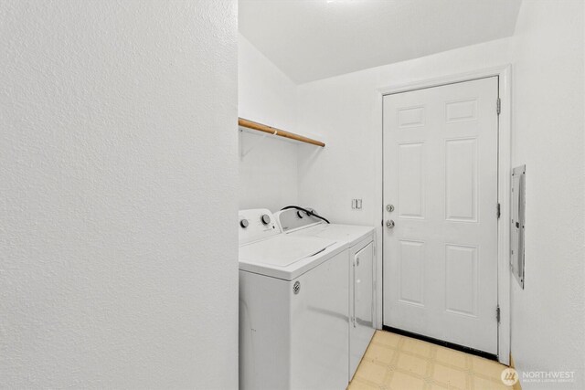 8363 Holly Ln, Maple Falls, WA 98266 - laundry room featuring light flooring, washing machine and clothes dryer, and electric panel