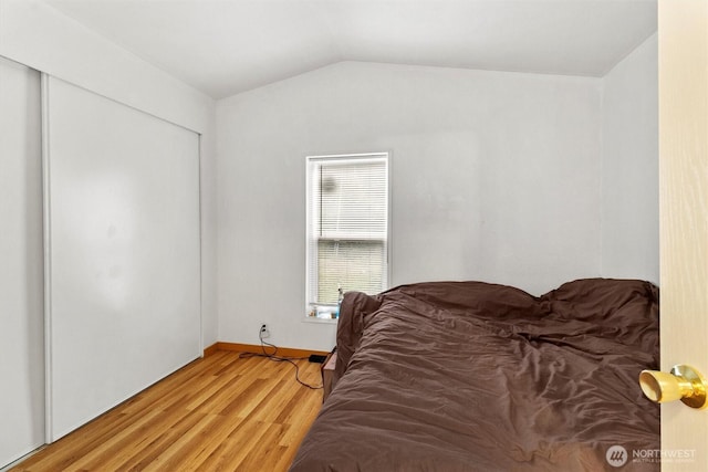 8363 Holly Ln, Maple Falls, WA 98266 - bedroom with lofted ceiling, light wood-type flooring, and a closet