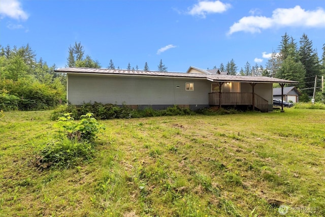 8363 Holly Ln, Maple Falls, WA 98266 - rear view of property featuring a lawn and a metal roof