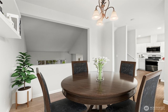 8629 240th St SW Unit B4, Edmonds, WA 98026 - dining area featuring light wood-type flooring, a chandelier, and recessed lighting