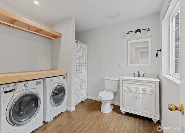 8629 240th St SW Unit B4, Edmonds, WA 98026 - laundry room featuring washer and dryer and wood finished floors
