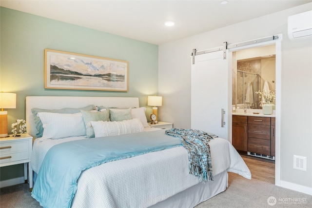 1322 194th St SE Unit H4, Bothell, WA 98012 - bedroom with a wall unit AC, a barn door, light carpet, ensuite bath, and recessed lighting