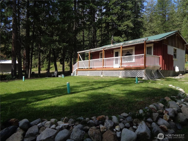 270 W Fork Rd, Conconully, WA 98819 - view of front of property featuring a front lawn, board and batten siding, and a wooden deck