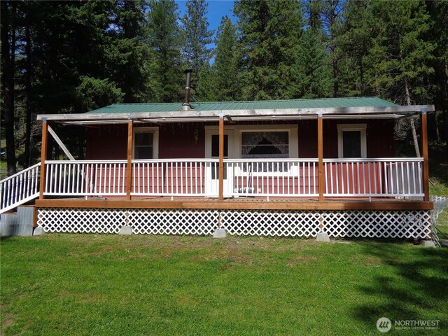 270 W Fork Rd, Conconully, WA 98819 - view of front facade with a porch, a front yard, and a metal roof