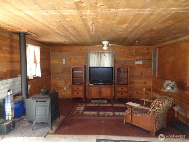 270 W Fork Rd, Conconully, WA 98819 - living area with wooden walls, wooden ceiling, and a wood stove
