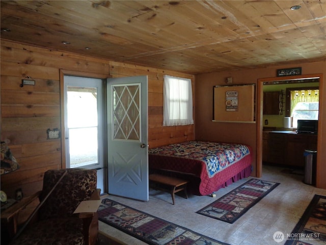 270 W Fork Rd, Conconully, WA 98819 - bedroom with wooden ceiling, wooden walls, and light wood-style flooring