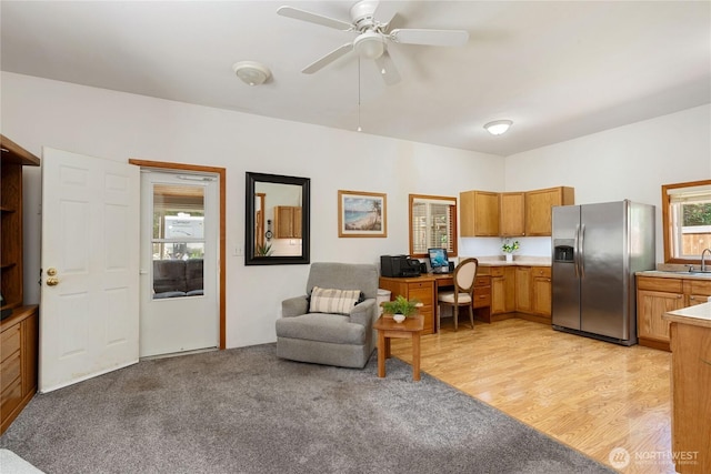 30 E Richardson Rd, Belfair, WA 98528 - living area featuring a ceiling fan, light colored carpet, and light wood-style floors