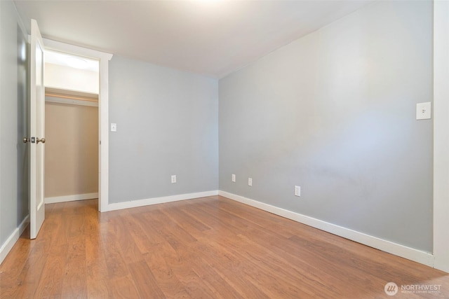 5253 35th Ave SW, Seattle, WA 98126 - unfurnished bedroom with light wood-style flooring and baseboards