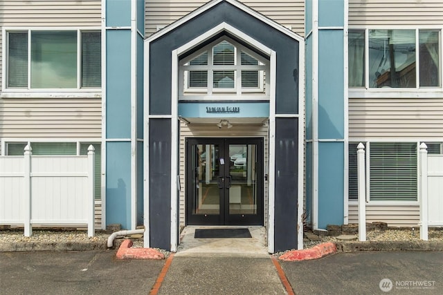 25 N Broadway Unit 207, Tacoma, WA 98403 - doorway to property featuring french doors and uncovered parking