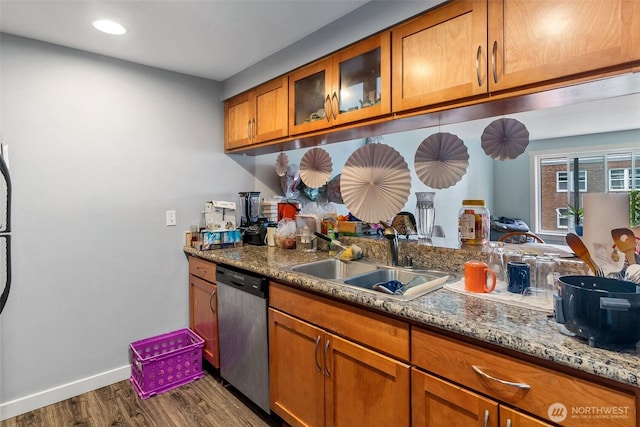 25 N Broadway Unit 207, Tacoma, WA 98403 - kitchen featuring dishwasher, brown cabinets, dark wood-type flooring, glass insert cabinets, and light stone countertops