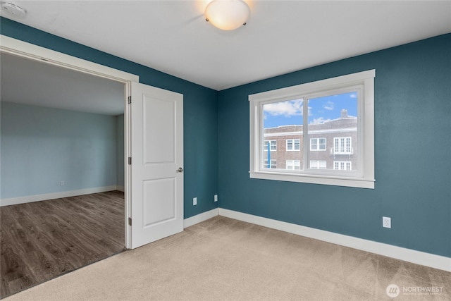 25 N Broadway Unit 207, Tacoma, WA 98403 - unfurnished bedroom featuring carpet and baseboards