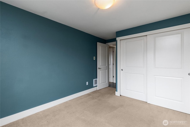 25 N Broadway Unit 207, Tacoma, WA 98403 - unfurnished bedroom featuring light carpet and a closet