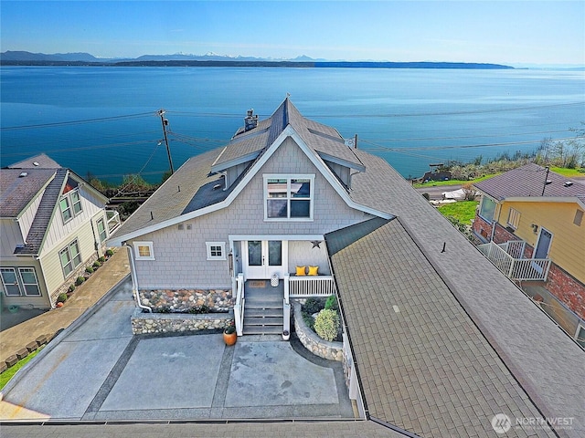 656 Lehman Dr, Camano Island, WA 98282 - view of front of home featuring a shingled roof and a water view