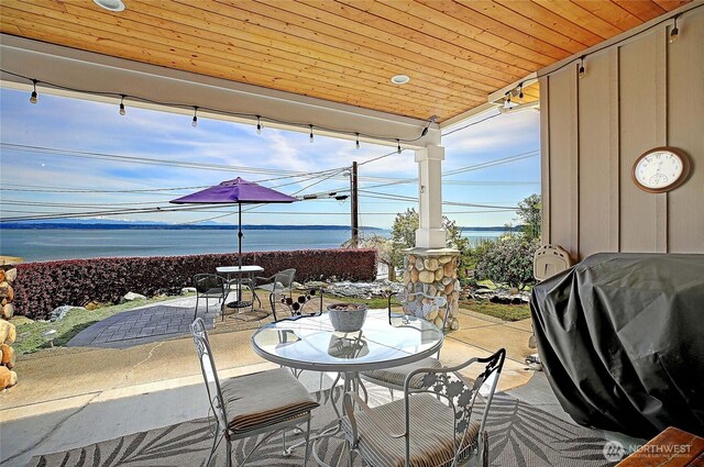 656 Lehman Dr, Camano Island, WA 98282 - view of patio / terrace with outdoor dining space, area for grilling, and a water view