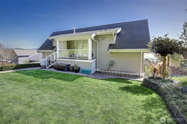656 Lehman Dr, Camano Island, WA 98282 - view of front of house featuring a shingled roof and a front yard
